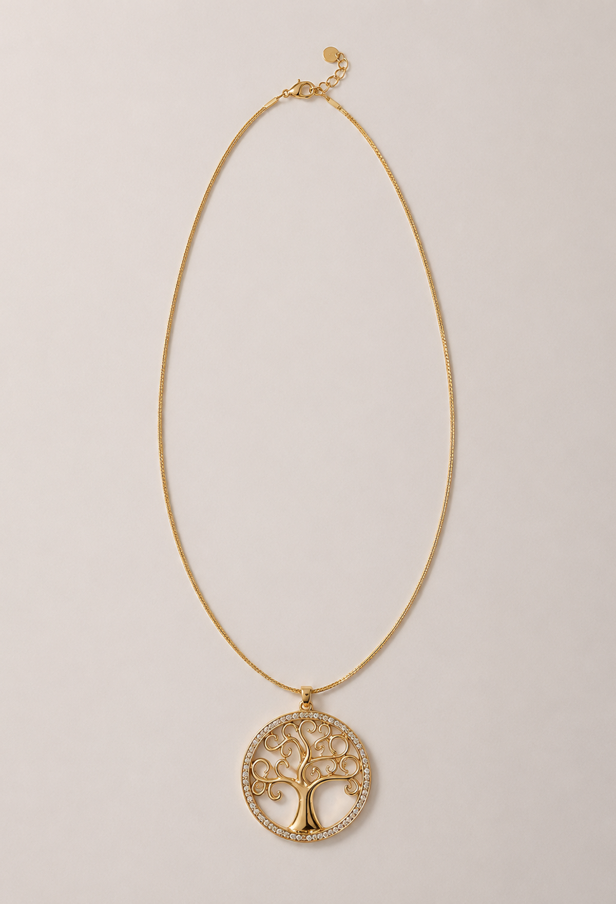 Collar de cadena dorada con medallón calado de árbol de la vida y cristales