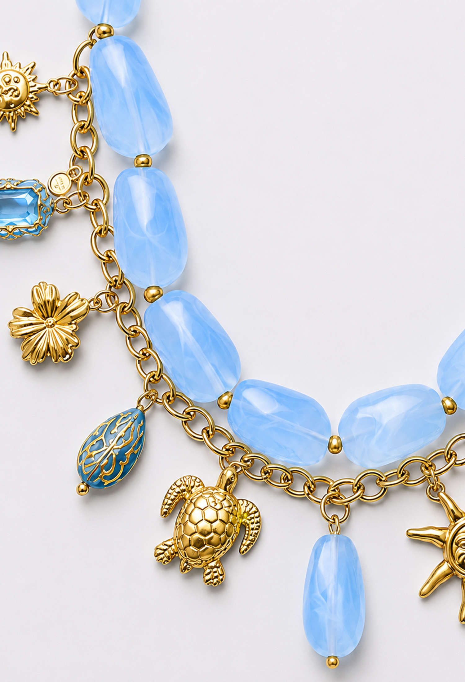 Collar statement de piedras marmoladas con cadena y dijes dorados de sol, estrella de mar y tortuga - Azules - vista 2
