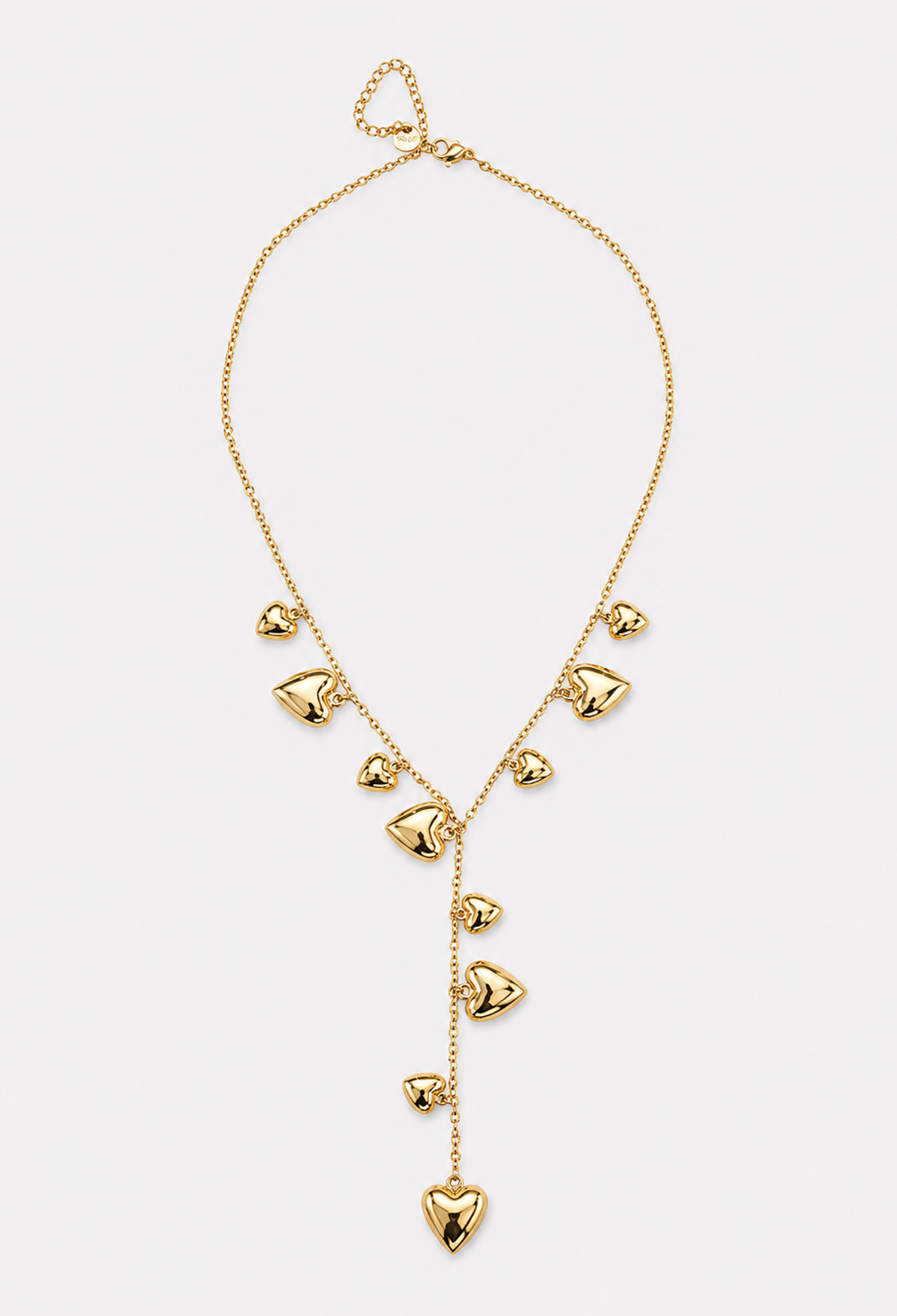 Collar dorado en Y con corazones voluminosos colgantes