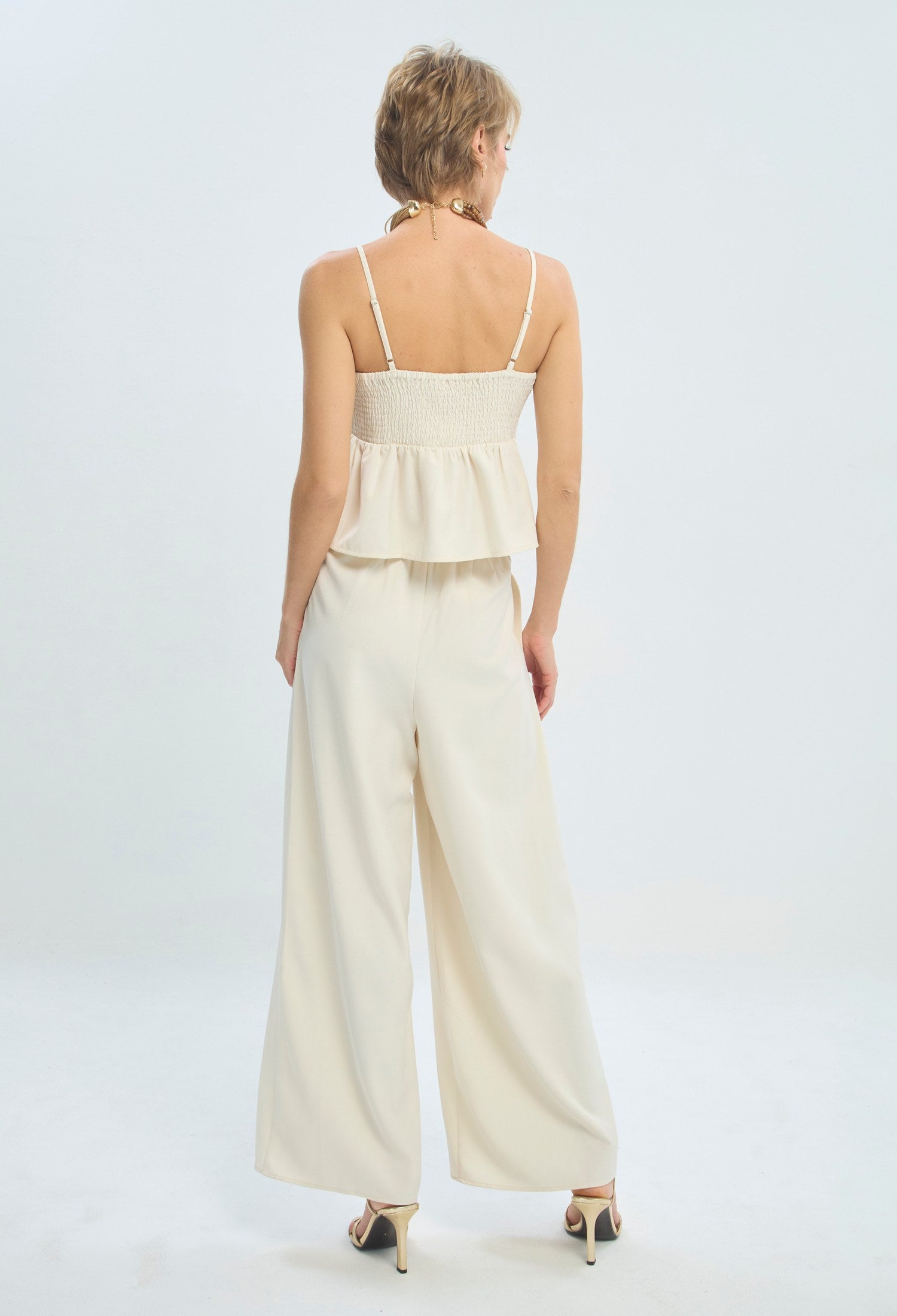 Conjunto crudo de blusa peplum con escote corazón y pantalón palazzo BYBLA - vista 5