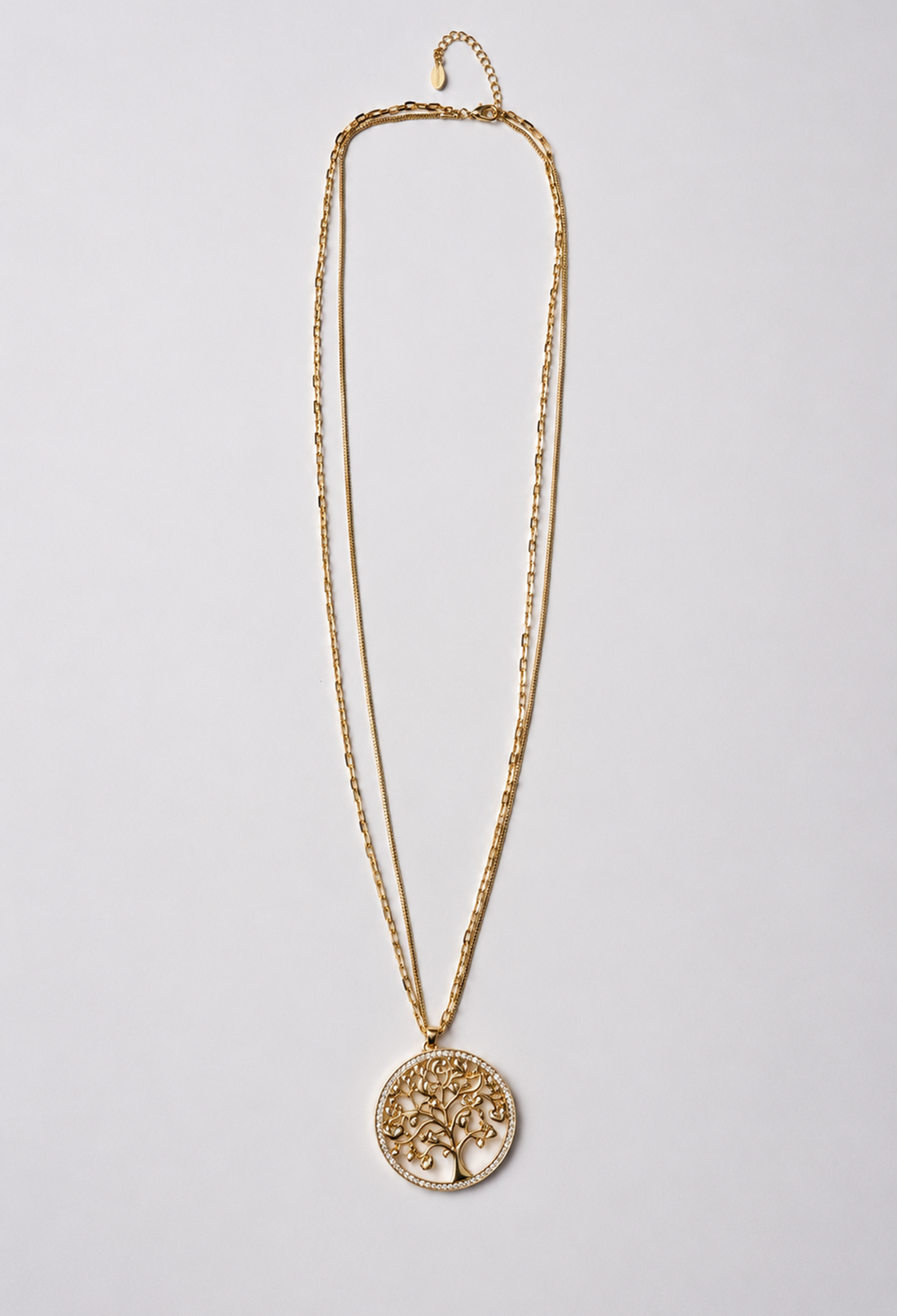 Collar largo dorado de doble cadena con medallón árbol de la vida y aro de circonias