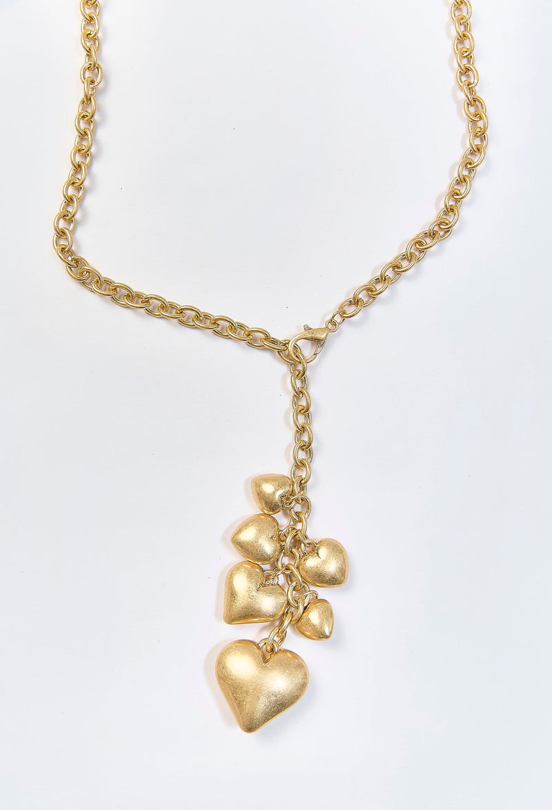 Collar dorado con dije metalico de corazon inflado escultorico - vista 2