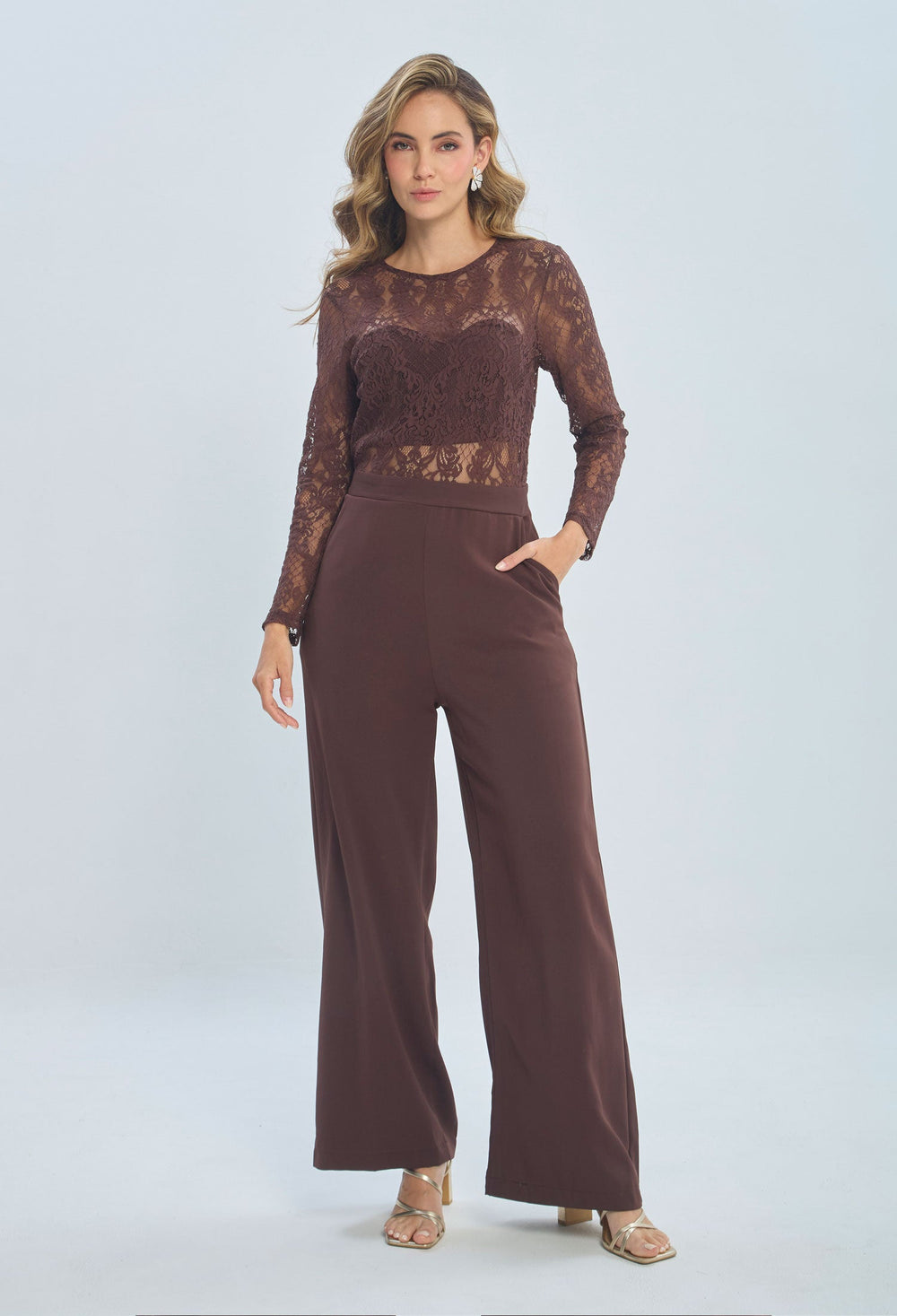 Woman wearing brown lace long-sleeve blouse and wide-leg pants, fashion outfit