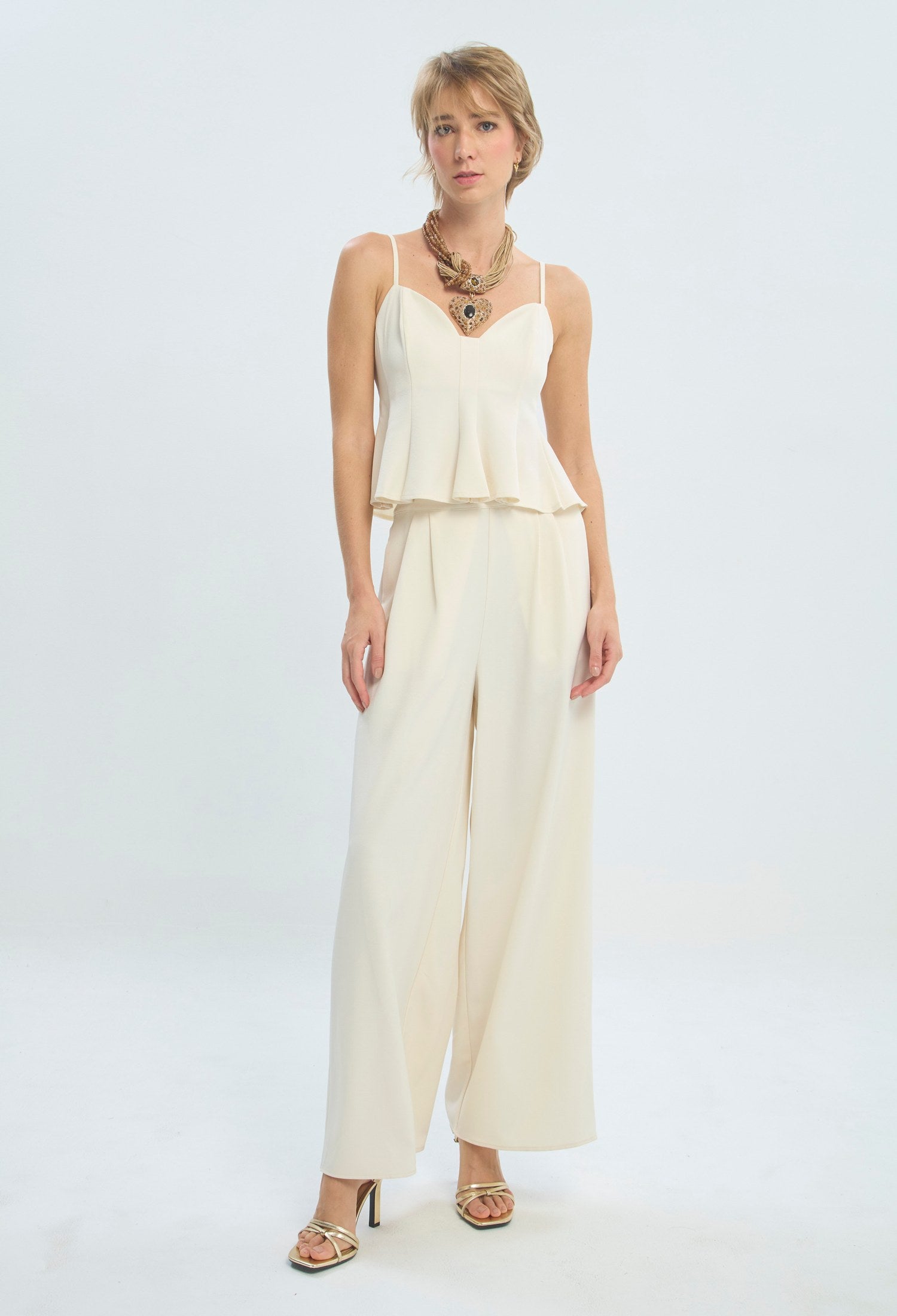 Conjunto crudo de blusa peplum con escote corazón y pantalón palazzo BYBLA - vista 6